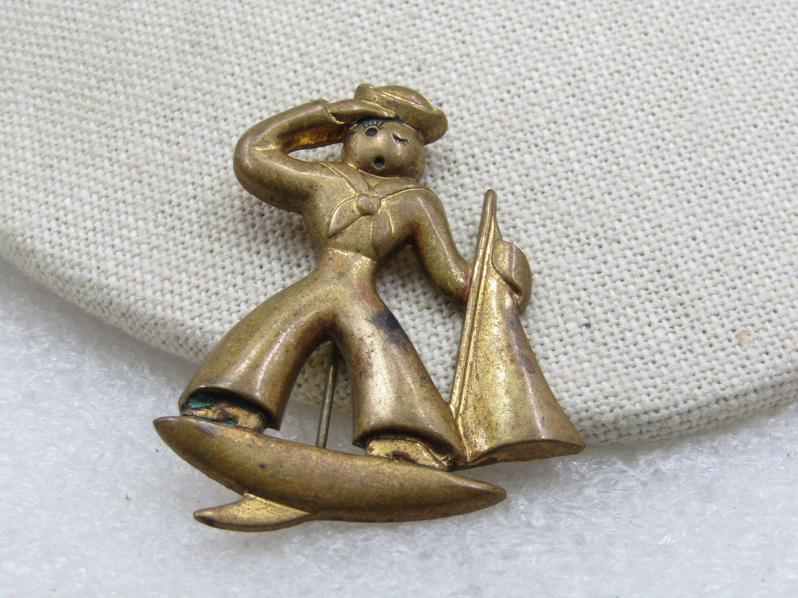 Vintage Sailor Brooch, Pressed Brass, 1920's-1930's, C-Clasp: Title: Vintage Sailor Brooch, Pressed Brass, 1920's-1930's, C-Clasp Description: Vintage Sailor Brooch, Pressed Brass, 1920's-1930's, C-Clasp. It is 2" tall and nearly 1.5" wide. A sailor soluting