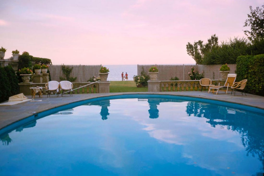 Sunset By The Pool 1962 Oversize Limited Signature Stamped Edition: 1962 (printed later): Title: Sunset By The Pool 1962 Oversize Limited Signature Stamped Edition: 1962 (printed later) Description: Sunset By The Pool 1962 People watch the sunset over the ocean while standing by a