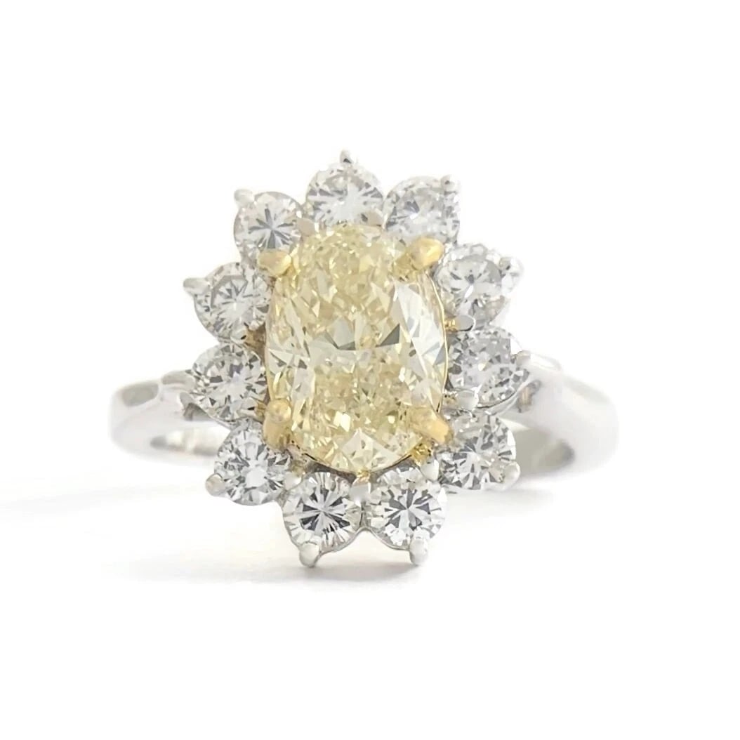 Fancy Light Yellow Oval Diamond Halo Statement Ring 18K White Gold, 2.28 CTW: Title: Fancy Light Yellow Oval Diamond Halo Statement Ring 18K White Gold, 2.28 CTW Description: Fancy Light Yellow Oval Diamond Halo Statement Ring 18K White Gold 2.28 CTW This is a gorgeous diamond