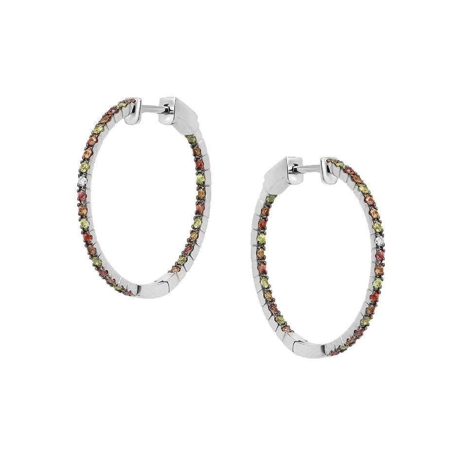 Impressive Multi Sapphire Diamond White Gold Hoop Earrings: Title: Impressive Multi Sapphire Diamond White Gold Hoop Earrings Description: Earrings White Gold 14 K Diamond 2-RND-0,03-G/VS1A Multi-Sapphire 58-0,95ct Weight 4.57 grams With a heritage of ancient
