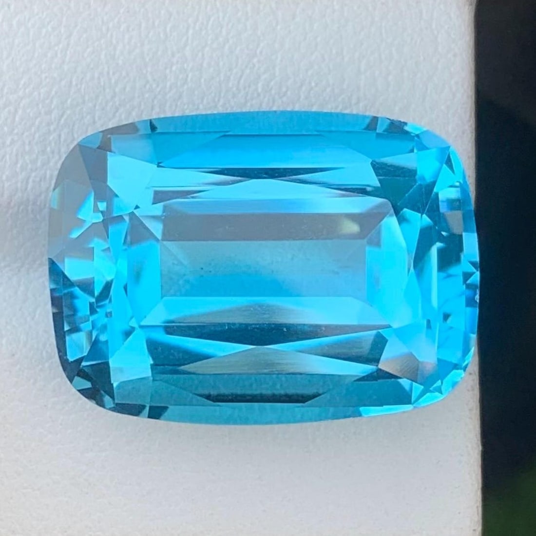42.90 Carat Natural Swiss Blue Topaz Gemstone, Cushion Cut Gem: Title: 42.90 Carat Natural Swiss Blue Topaz Gemstone, Cushion Cut Gem Description: Supplies for making crafts Materials: Gemstone: Topaz Carat weight: 42 Introducing a magnificent Swiss Blue Topaz gem