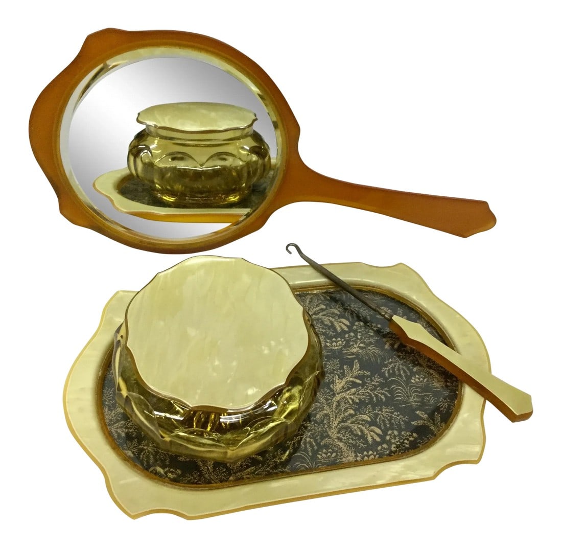 1950s Vintage Bakelite Vanity Set- 4 Pieces: Rare set of original Bakelite accessories. Use this set in your dressing room or even on your personal writing table. The hook opens letters with ease. The jar can hold clips and rubber bands. The