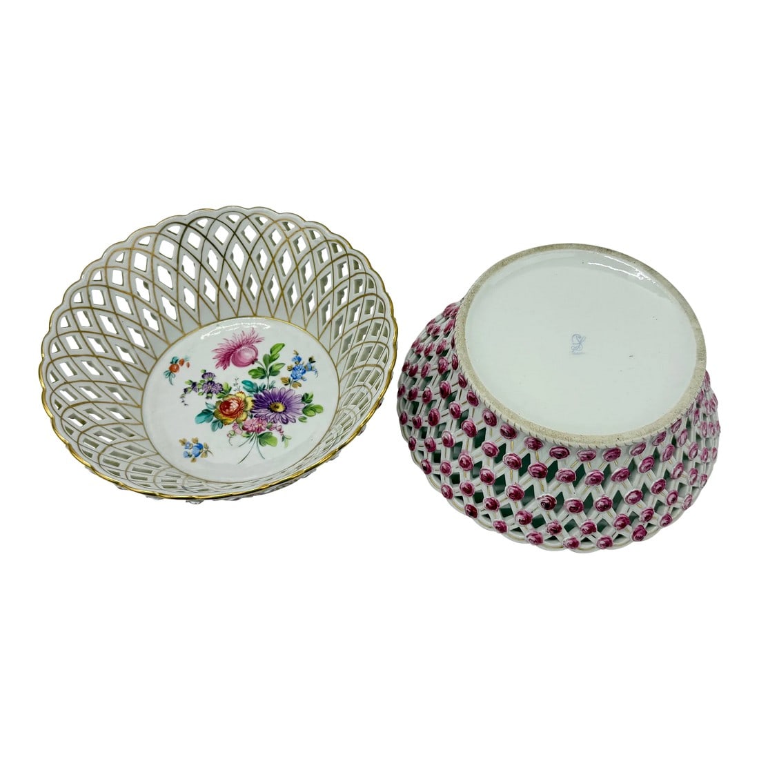 Pair, Fine Dresden Porcelain Reticulated Pierced Rose Bud Baskets C. 1910: This exquisite pair of Dresden porcelain baskets, dating to circa 1910, showcases the exceptional artistry and attention to detail for which Dresden porcelain is celebrated. The interiors of the