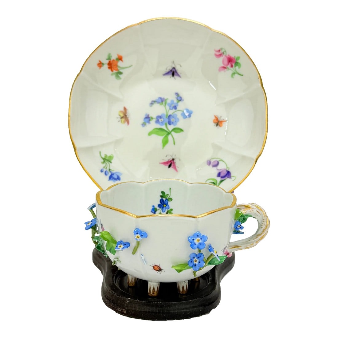 Antique Meissen Porcelain Floral Encrusted Tea Cup & Saucer: Meissen, Germany, late 19th to early 20th century Hard-paste porcelain, hand-painted with polychrome enamels and gilt accents, applied porcelain flowers, five small knop feet. This exquisitely