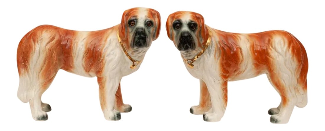 19th Century Large English Porcelain St. Bernard Dog Sculptures - a Pair: Fine pair of large 19th century English porcelain St. Bernard Dog sculptures with inserted glass eyes and gold collars. Beautifully hand painted and glazed. Very expressive faces. Unmarked. Nearly