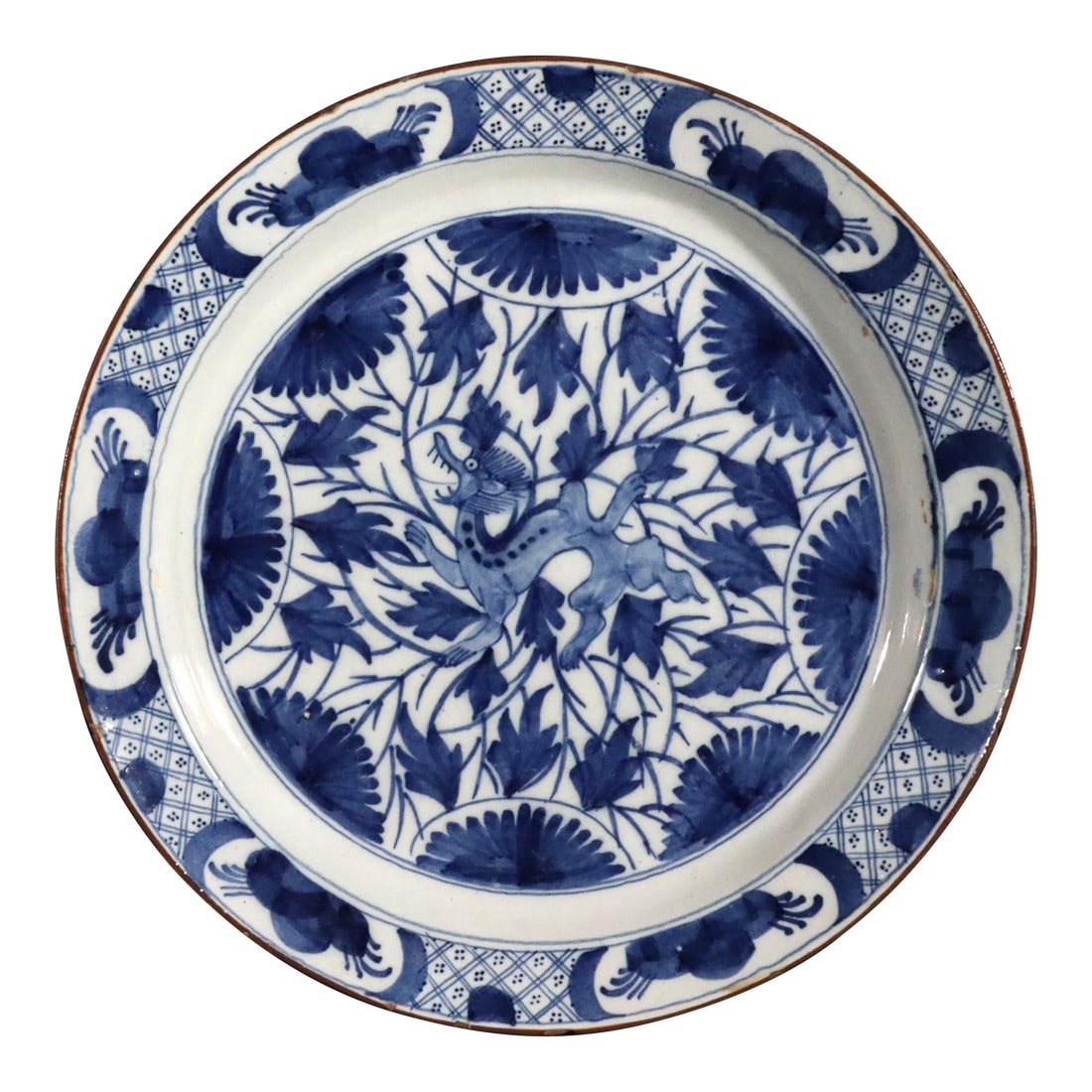 Dutch Delft Large Dish With Chinoiserie Dragon Design: Dutch Delft Large Dish with Chinoiserie Dragon Design, Circa 1700 The large Dutch Delft dish with a Chinoiserie design after the Kangxi is centered by a dragon amongst stylized flowering branches. 