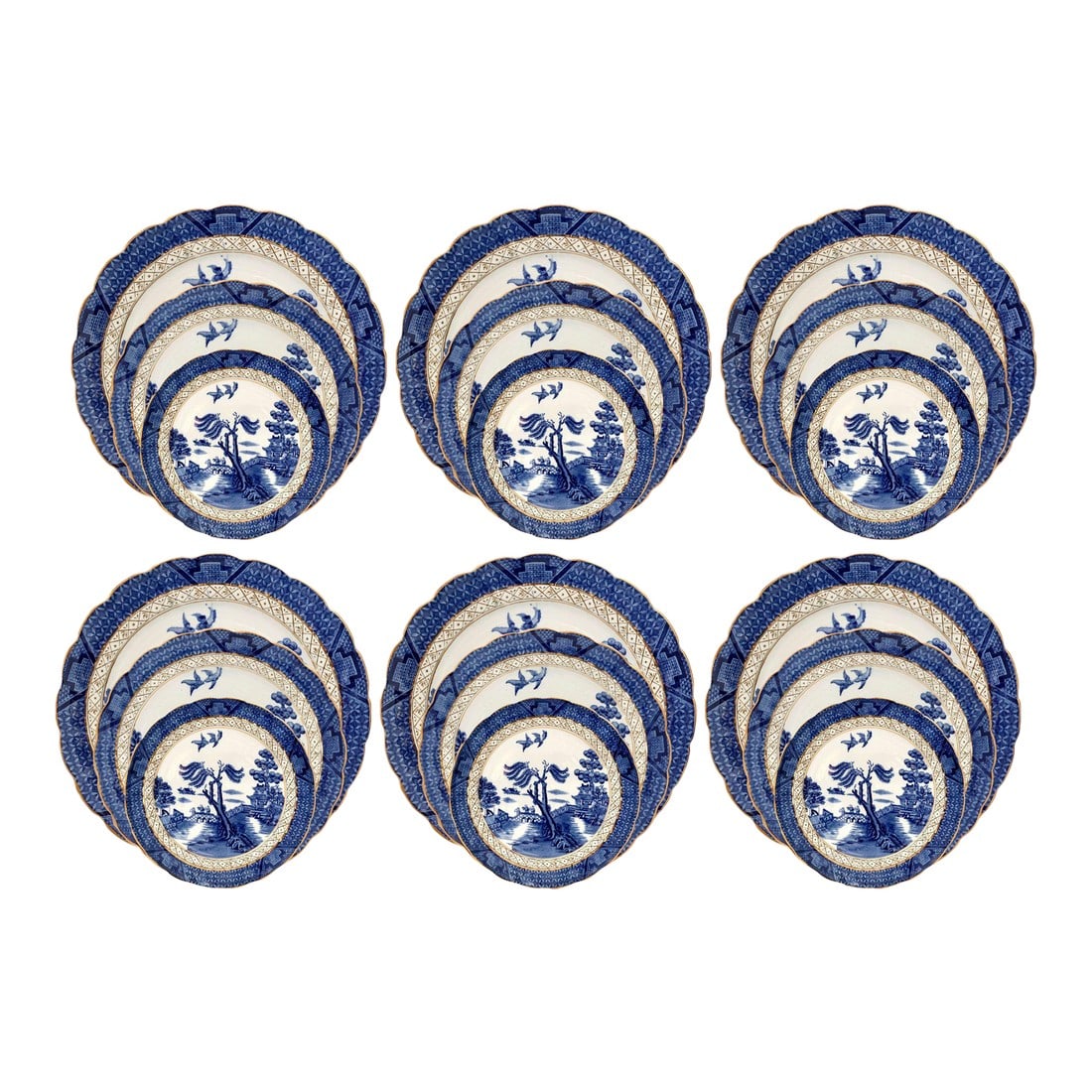English Willow Dinnerware, Service for 6: Classic 18-piece Booth's Real Old Willow ironstone set, made in England. Rich cobalt blue transferware with scalloped, gold-edged rims. Set includes Six 10" dinner plates, Six 9.5" luncheon plates,