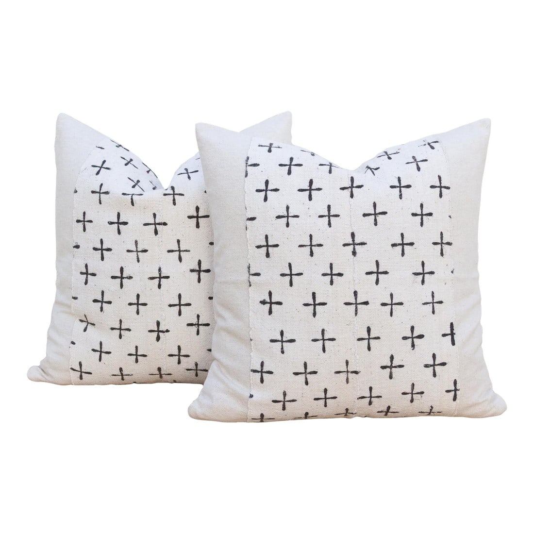 Pair of Earthen African Mudcloth Throw Pillows: This compelling pair of decorative pillows is a profound example of how simple form can carry powerful meaning. Each 18-inch square pillow is crafted from authentic African Mudcloth (Bogolanfini), a t