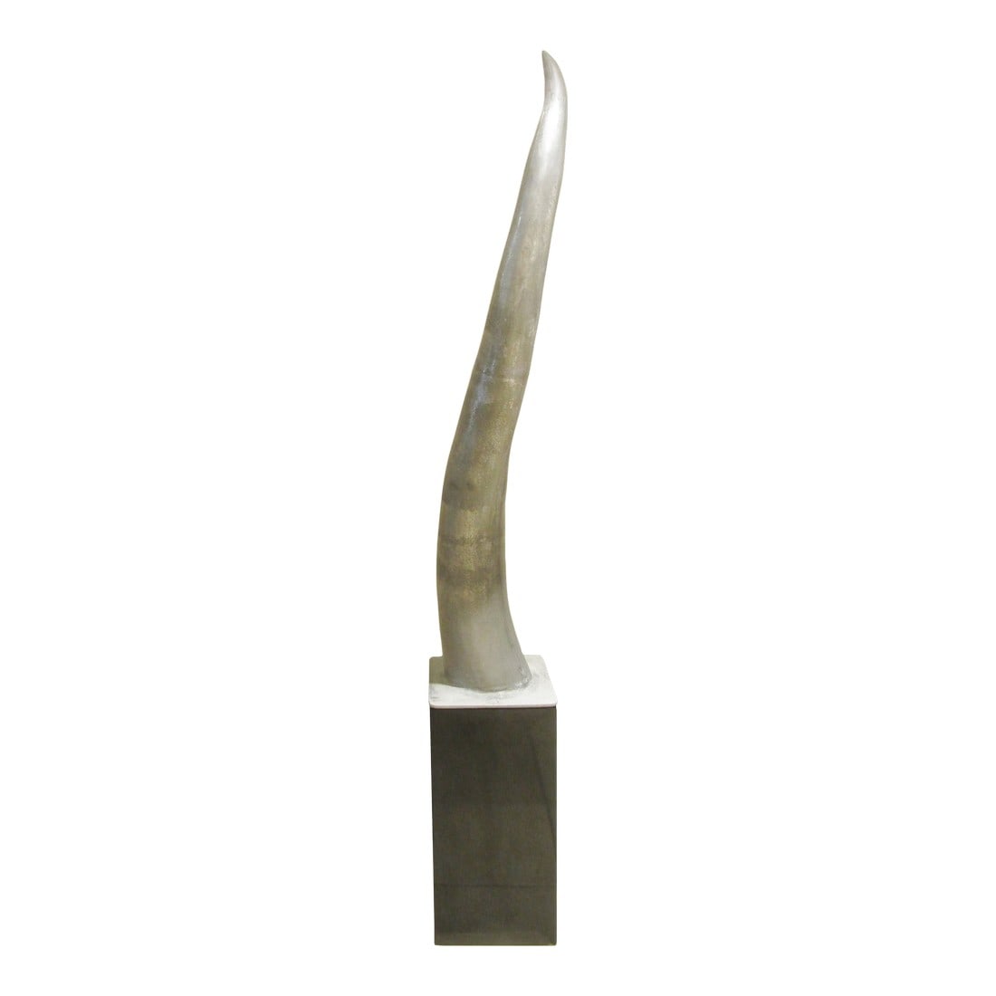 Large Cast Raw Aluminum Sculptural Horn Tusk on Pedestal: This large cast raw aluminum sculptural horn tusk on pedestal is a striking piece of modernist art. The oversized tusk, crafted from aluminum using a cast production technique, stands as a unique and