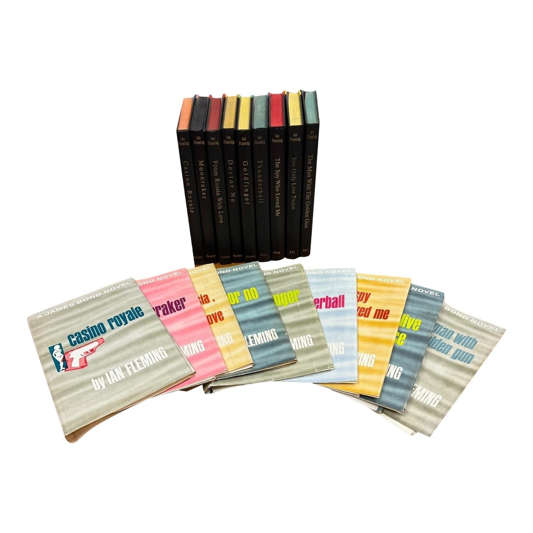 1950s Complete Set of 9 James Bond Hardcover Books by Ian Fleming: A complete set of 9 James Bond Novels by Ian Fleming in the uniform dust jacket design and uniform black with color hardcovers. Book Cub Editions-American All are bound in similar black and colored
