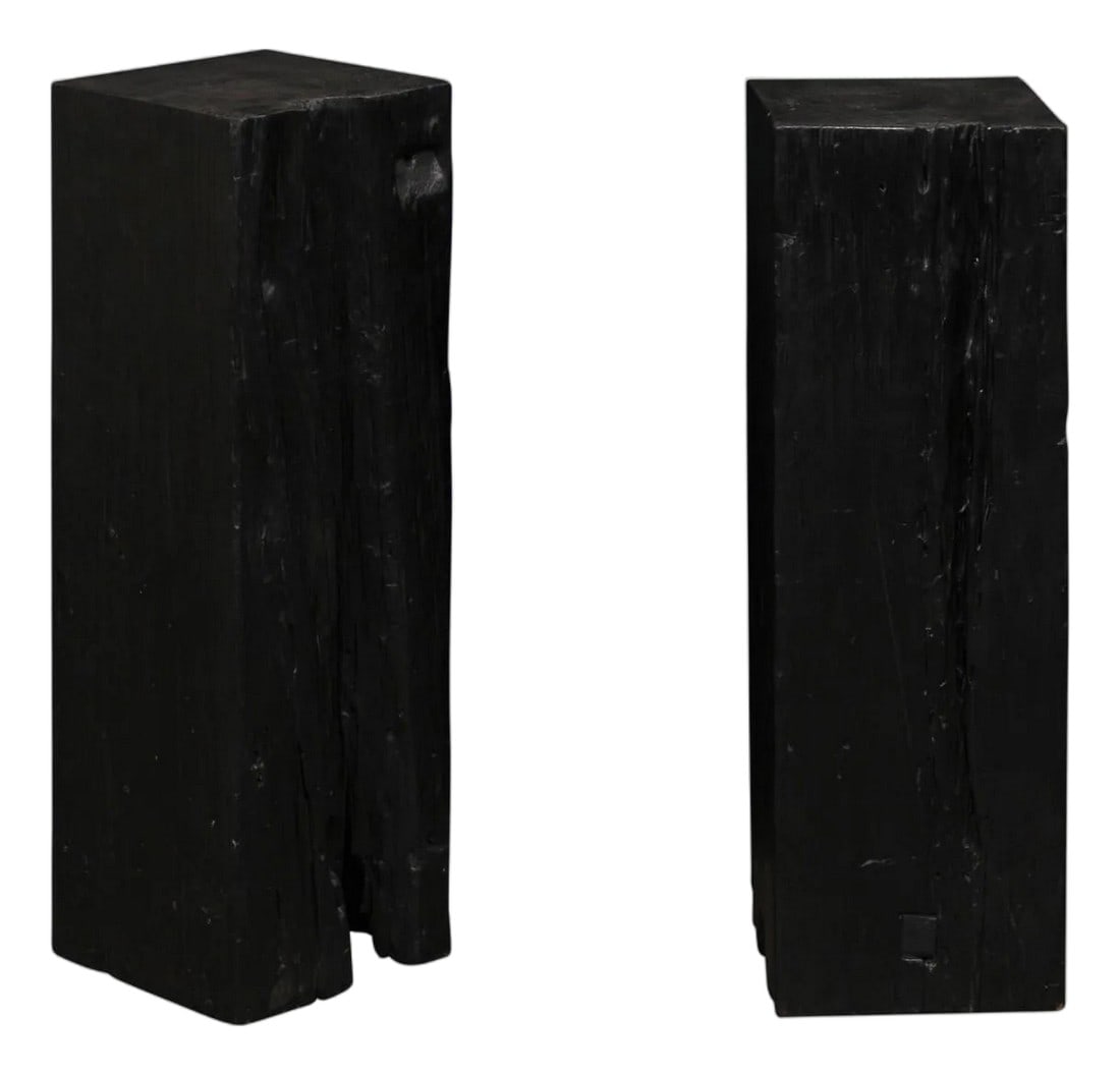 19th Century Indonesian Carbonized Ironwood Pedestals – A Pair: An Indonesian pair of carbonized ironwood columns from the 19th century. These antique pedestals from Indonesia have squared bodies, which have been created from reclaimed Merbau wood which has been c