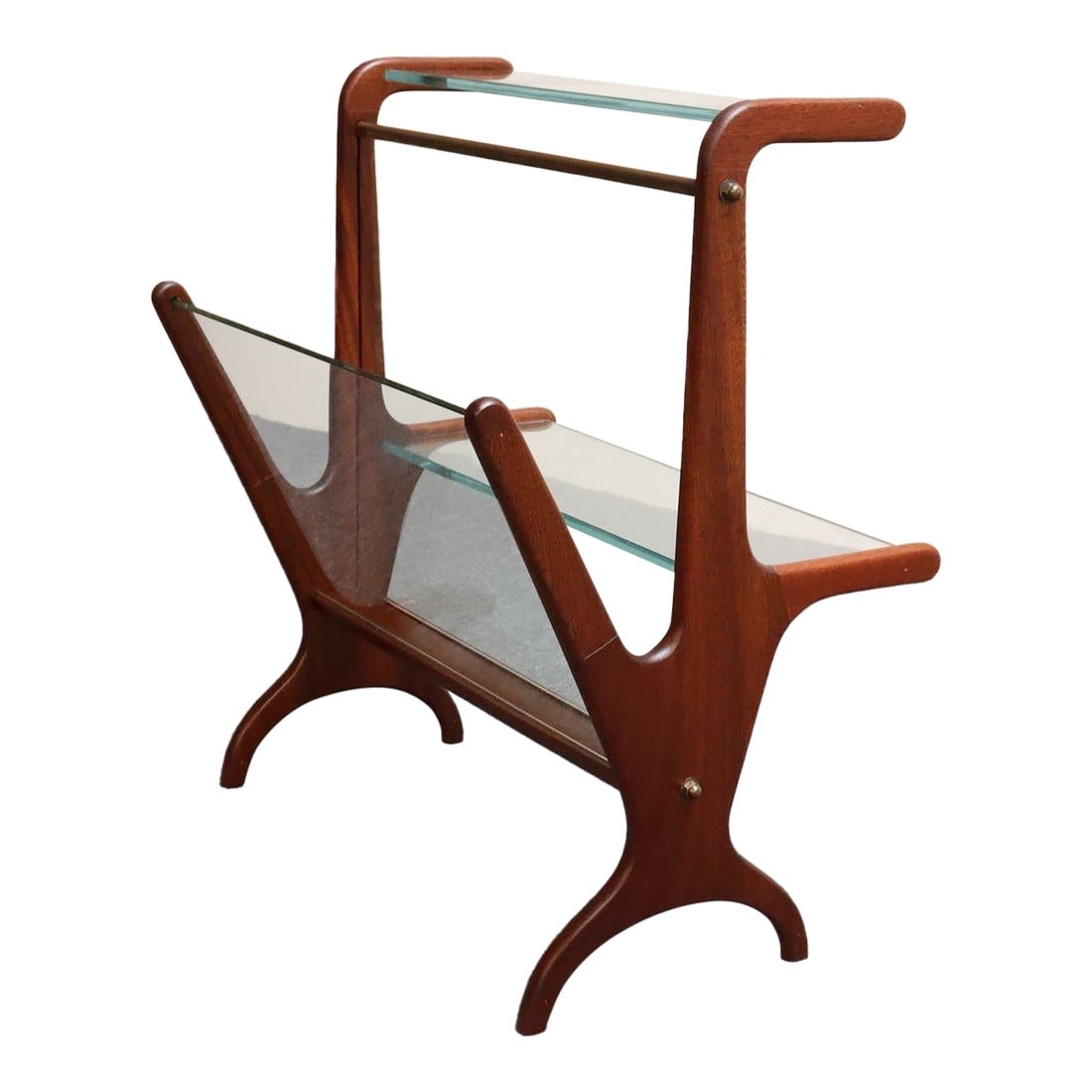 Vintage Italian Modern Sculptural Walnut, Brass and Glass Magazine Rack / Stand: Architectural two-tiered magazine/book/periodical stand/rack/table (ca. 1950s, Italy). Composed of a deeply sculpted stained Italian Walnut frame supporting a tubular brass rail with exposed brass har
