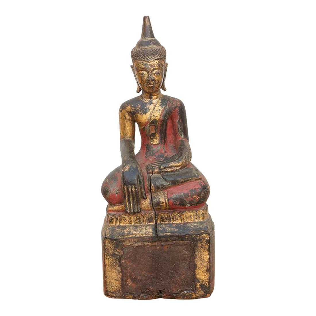 Gilt & Rouge Antique Devotional Seated Buddha: A soulful piece of devotional art, this hand-carved wooden figure depicts the Buddha seated in the Bhumisparsha mudra on a high, block-form throne. The statue features a traditional "Rouge & Gold"