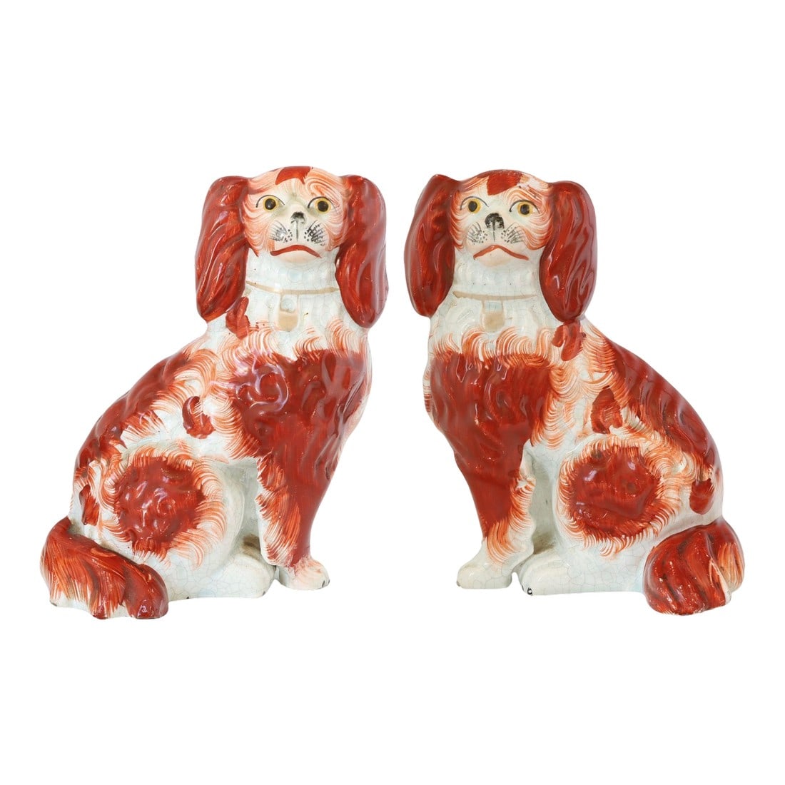 C. 1860 English Staffordshire King Charles Spaniel Dogs: Pair of antique Staffordshire spaniels, circa 1860, hand-painted in russet and white. Rare separate front leg modeling. Charming addition to most decors. Unmarked, as typical of early Staffordshire