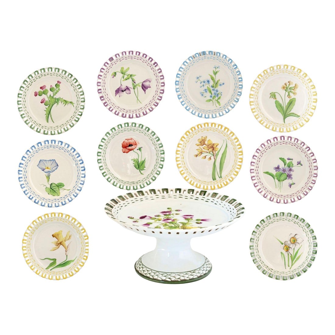 Antique French Luneville Floral Dessert Set With Cake Stand: A charming antique French dessert service by Lunéville, France, featuring hand-painted botanical studies, each framed by a softly scalloped rim and pastel borders. Anchored by a matching