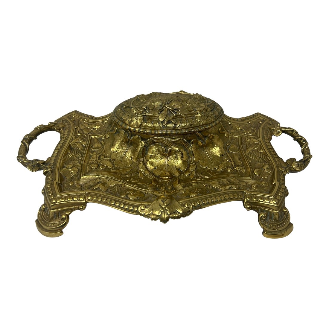 Antique Monumental Art Nouveau Brass Desk Inkwell With Botanical Relief, Circa 1900: A monumental antique Victorian cast brass double inkwell dating to circa 1900. Measuring an impressive 15 inches wide, this substantial desk accessory features flowing botanical relief, ribbon-and-gar