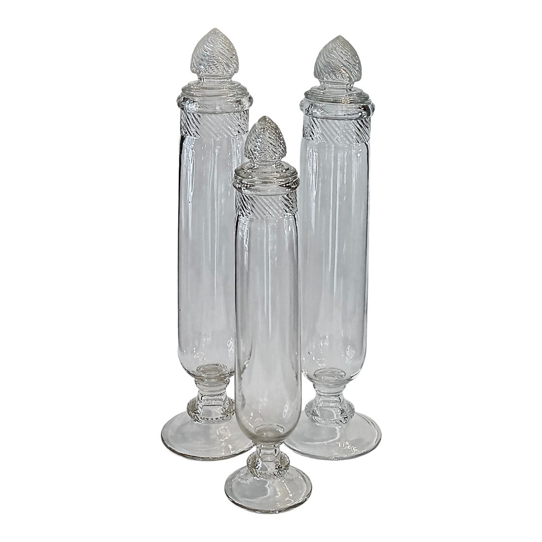 19th Century Molded Glass Apothecary Jars, Set of Three, Barley Twist Lids: A beautifully proportioned set of three 19th-century molded glass apothecary jars with barley-twist lids and soft antique tonality. A striking set of three molded glass apothecary jars, England,