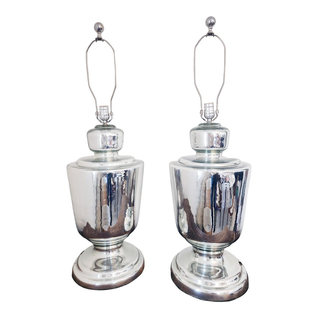 Pair of Mid-Century Mercury Glass Table Lamps, Circa 1950s: An elegant pair of mid-century mercury glass table lamps dating to the 1950s–1960s. Featuring hand-blown silvered glass bodies in a classic urn form, these lamps offer a refined balance of tradi