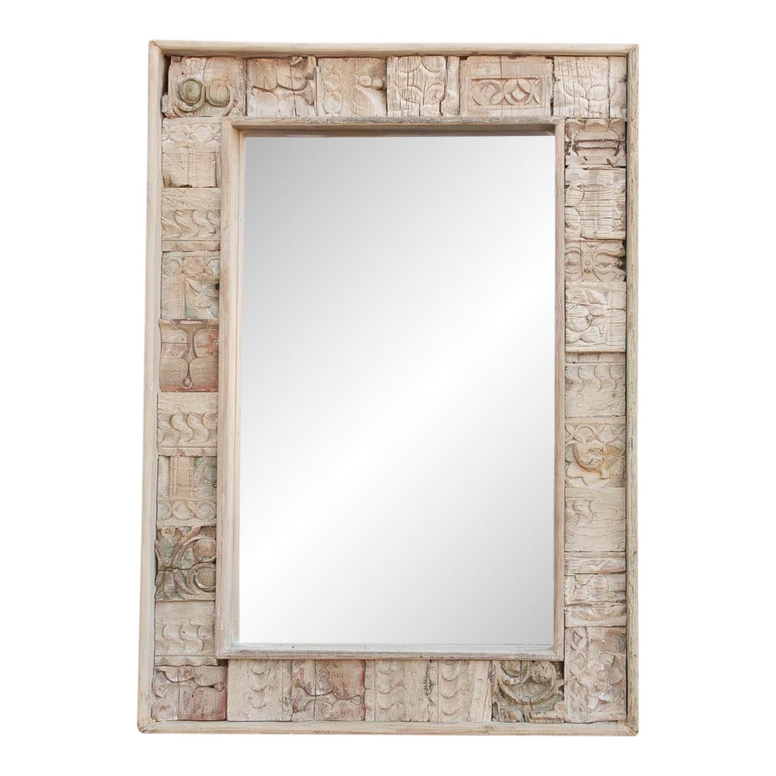 34" Reclaimed Carved Patch Work Mirror: This mirror is a piece of history, re-imagined. Designed and hand-assembled by our de-cor team, it gives a second life to a collection of vintage architectural carvings that might otherwise have been