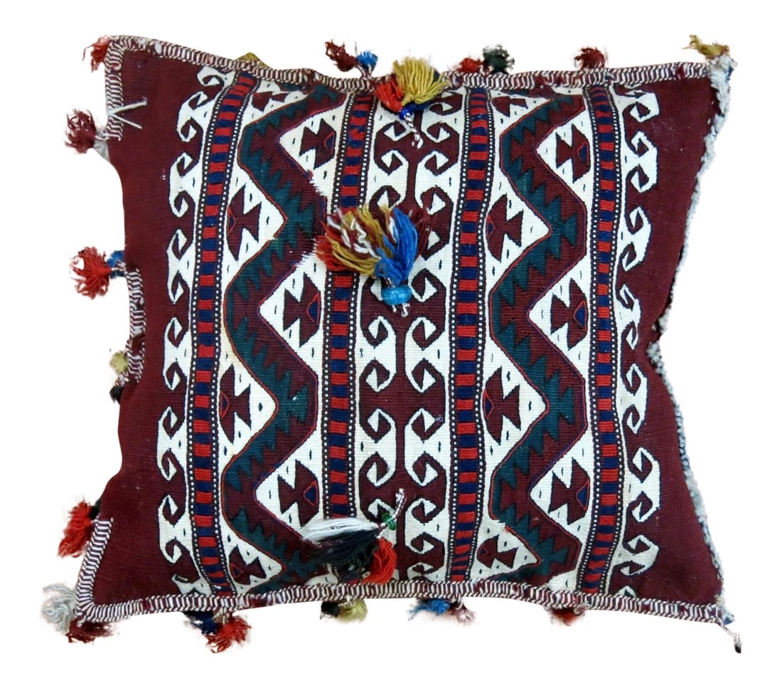 19th Century Antique Turkeman Tasseled Pillow: An early 20th century Turkemen pillow we acquired from a private estate. We loved the tassels the weaver added giving it more of a unique character. Sewn shut with polyfill insert. 18'' x 18'' The