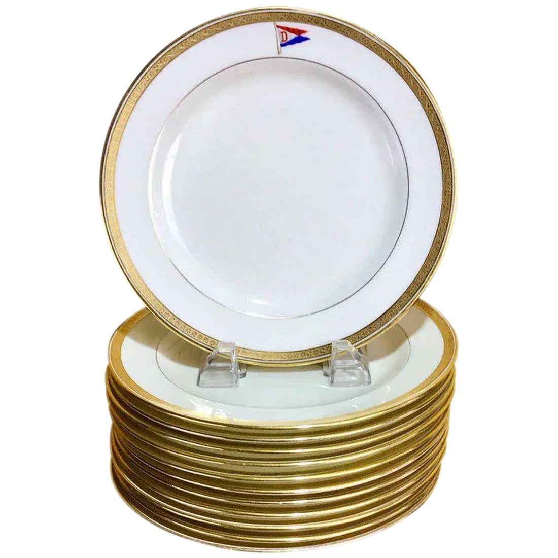 Cauldon First Class Steamship or Yacht Dessert Plates - Set of 12: 12 Cauldon first class steamship or yacht dessert plates, Each one gold encrusted rims with central crest of a red, white and blue with "D" Racing Pennant . Retailed by Higgins & Seiter, Painter &