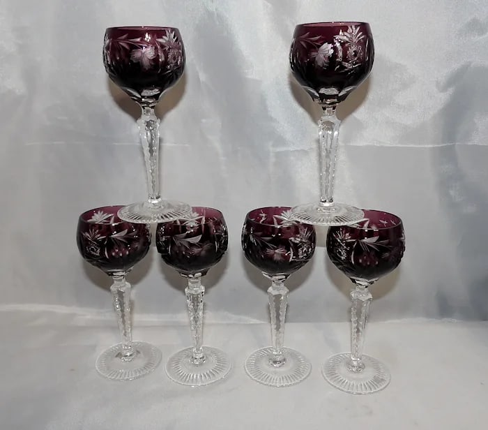 Nachtmann Traube Amethyst Liqueur Glasses: Exquisite amethyst-colored cut-to-clear crystal sherry or liqueur glasses in the 'Traube' (Grape) pattern by Nachtmann. Shipping: Domestic: Flat-rate of $20.00 to anywhere within the contiguous U.S. I