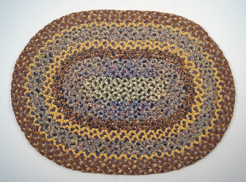 Antique Braided Table Mat County Americana #9: Title: Antique Braided Table Mat County Americana #9Dimension: App. 14” long x app. 10 ½” wideDate: Ca. 1930’s-40’sAdditional Information: An intricate Antique