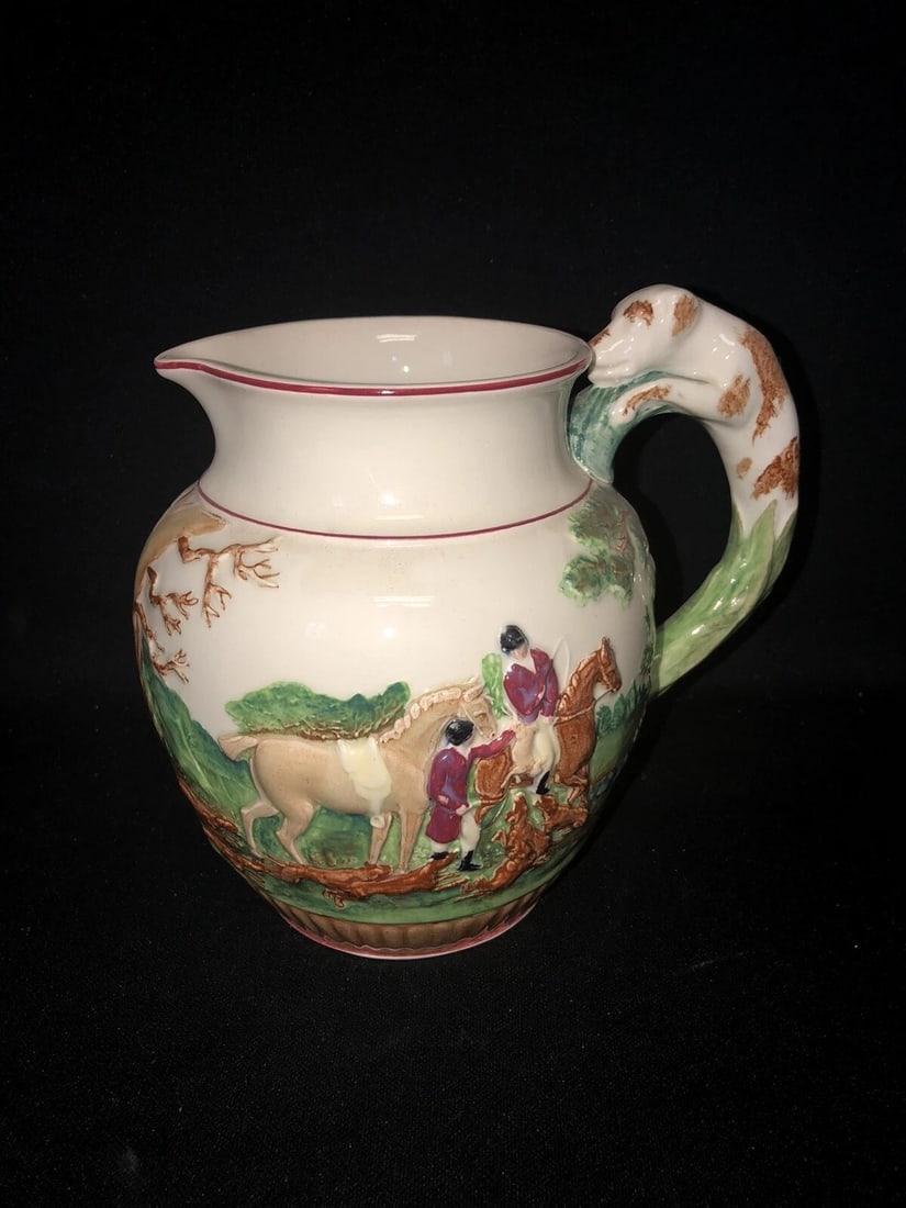 7 1/2” Wedgwood Majolica Dog Handled Pitcher: It is 7 1/2” high and is marked. It has no chips, cracks or repairs Shipping:Domestic: Flat-rate of $15.00 to anywhere within the contiguous U.S.International: Foreign shipping rates are