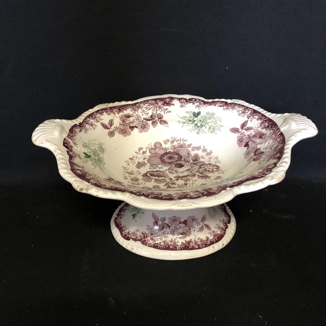 13 1/4” Staffordshire 2 Color Compote: It measures 13 1/4” x 10 1/4” x 6” and dates around the 1830’s. It has a small factory flaw and several very small spots on the top rim with paint wear. Otherwise it has no