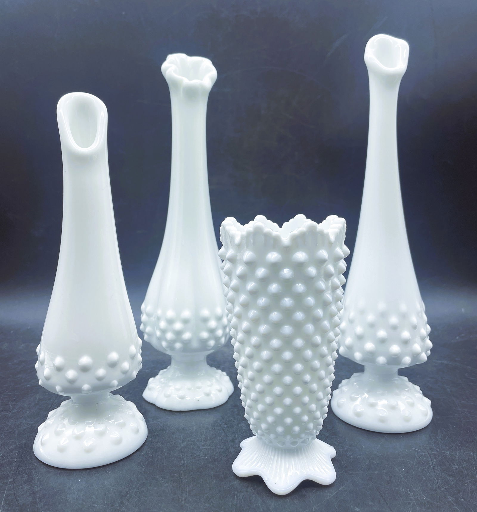 Lot of 4 Milkglass Hobnail Vases Fenton: Date/Period: unknownDimension: Range from 9.5" to 5"Material: glassAdditional Information: Lot of 4 Milkglass Hobnail Vases I believe these are all Fenton but am not certain Shipping:Domestic: