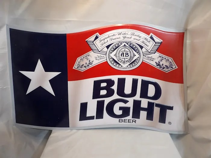 Vintage Bud Light Texas Flag Metal Sign: Vintage Bud Light embossed metal advertising sign featuring the Texas state flag. Shipping:Domestic: Flat-rate of $27.00 to anywhere within the contiguous U.S.International: Foreign shipping rates