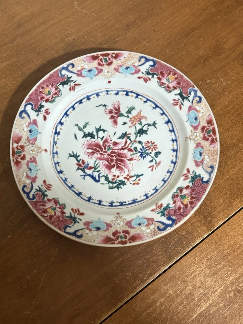 Early 19th Century Chinese Export Porcelain Famille Plate: It measures 9” and dates around the early 1800’s. It has several shallow flakes on the underside of the rim. Otherwise it is in good condition with no chips, cracks or repairs 