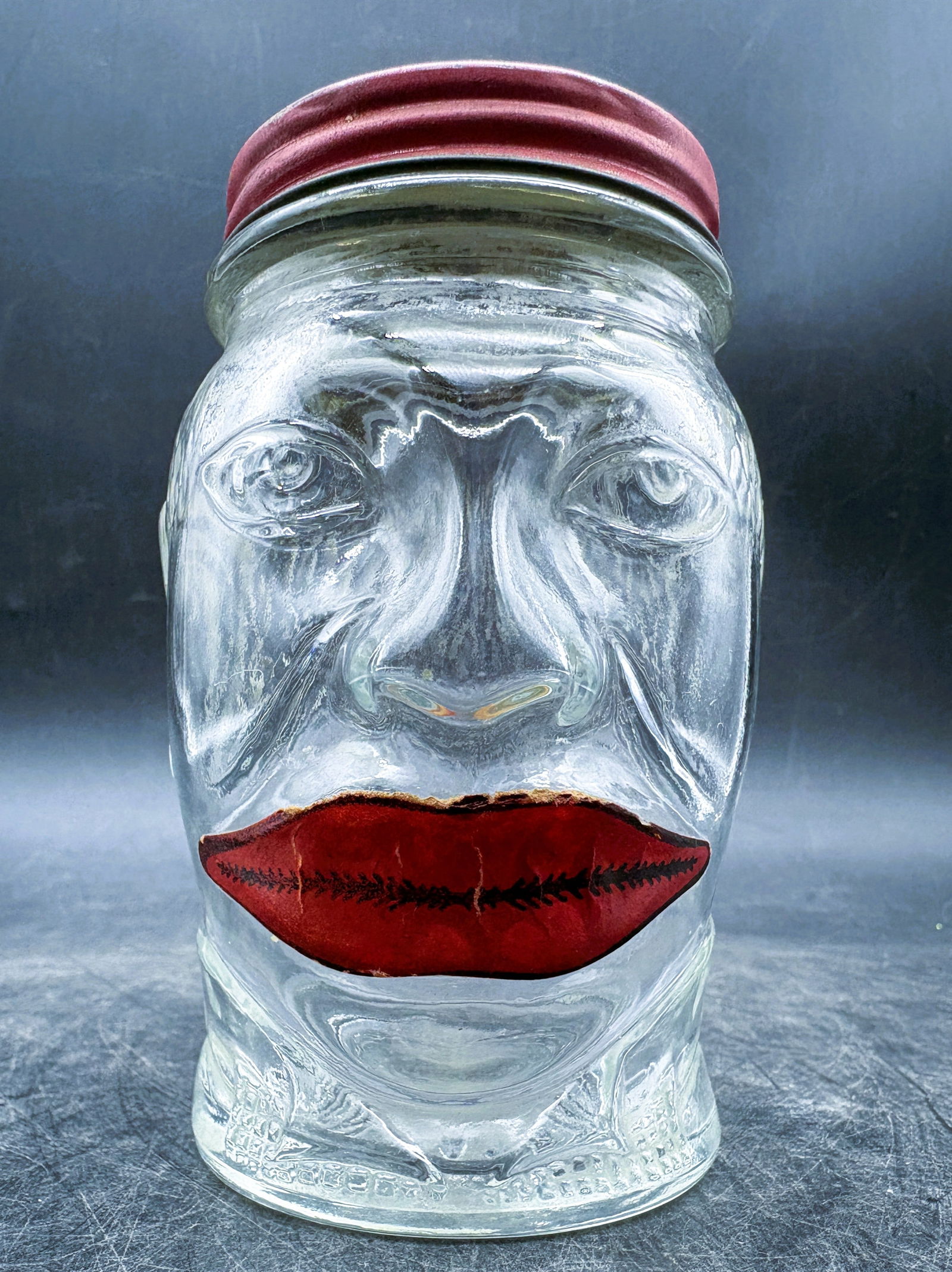 Vintage Lucky Joe Glass Coin Bank Black Americana: Date/Period: Approx. 1930-40'sDimension: Approx. 5" tallMaterial: glass, metalAdditional Information: Vintage Lucky Joe Glass Coin Bank Black Americana Shipping:Domestic: Flat-rate of $11.00 to