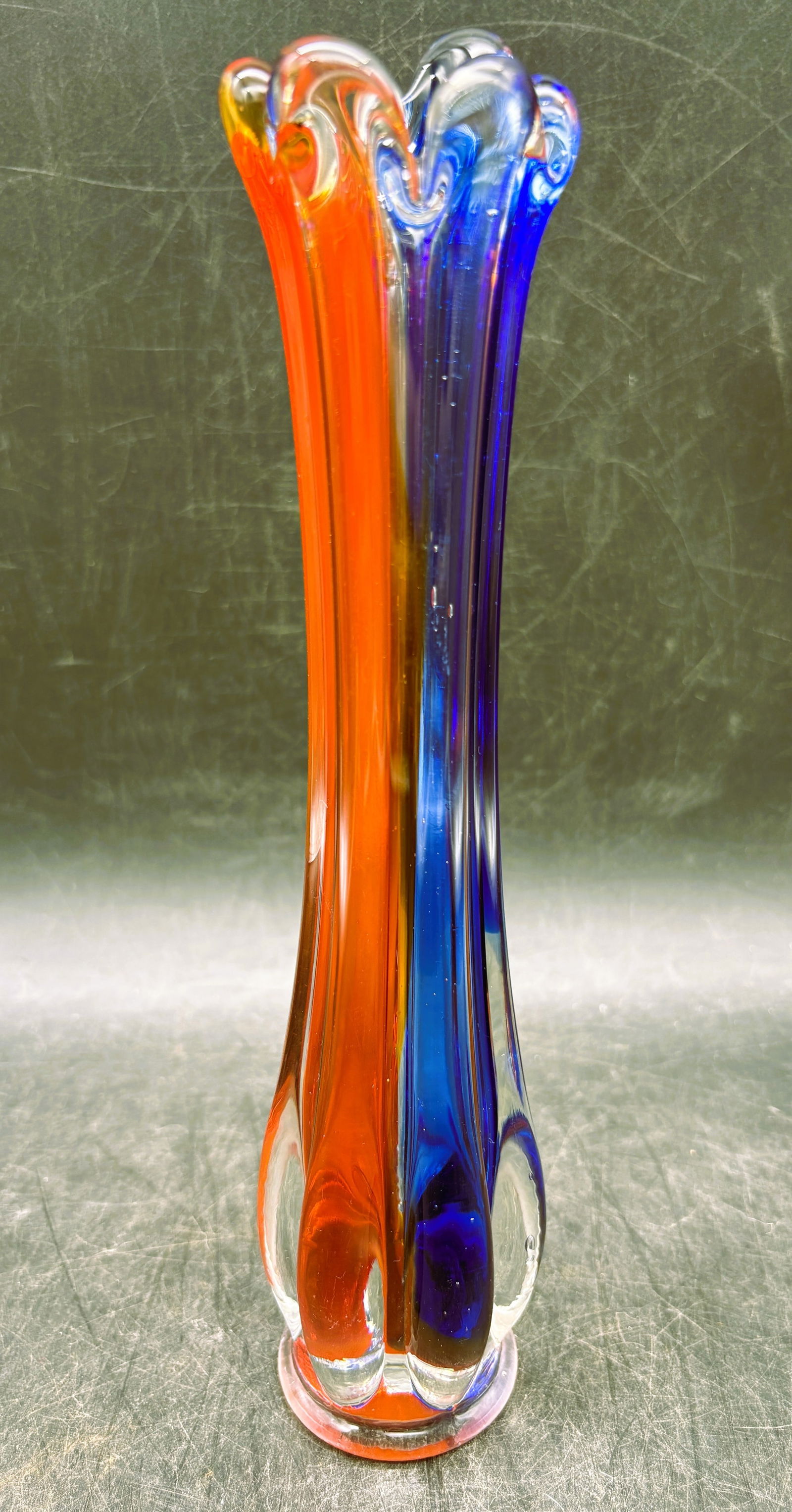 Vintage Murano Swung Glass Vase: Date/Period: unknownDimension: Approx. 9.5" tall x 2" diam.Material: glassAdditional Information: Vintage Murano Swung Glass Vase red, clear, and blue glass. Shipping:Domestic: Flat-rate of $12.00