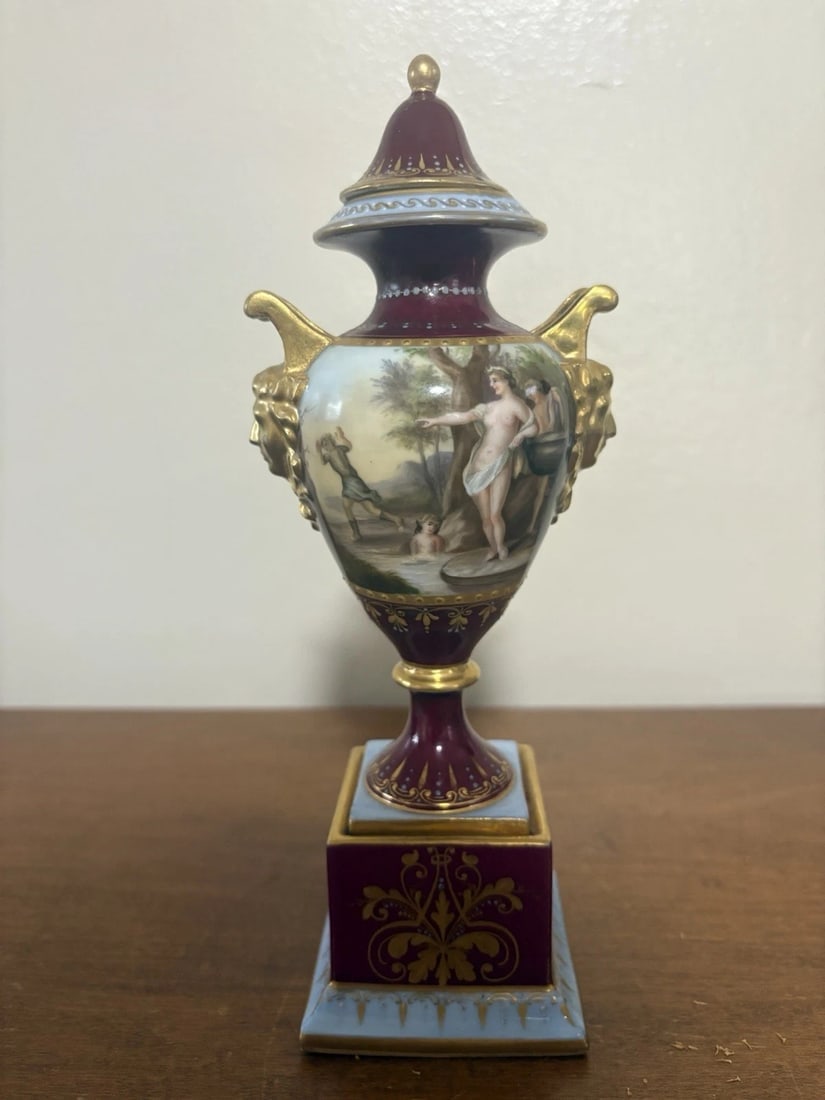 Royal Vienna Porcelain Artist Signed Urn: It is 9” high and is marked and artist signed. One handle has been repaired. Otherwise it has no other issues Shipping:Domestic: Flat-rate of $15.00 to anywhere within the contiguous