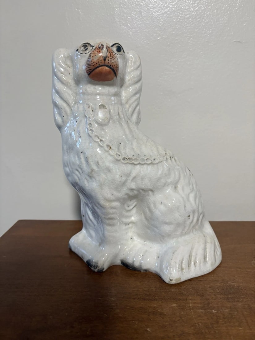 Staffordshire Spaniel Dog: It measures 9 3/4” high x 6 3/4” x 4 3/4” and dates around the 1880’s. It has minor light discoloration and crazing Shipping:Domestic: Flat-rate of $15.00 to anywhere within