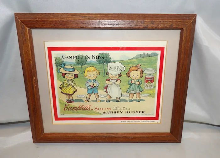 1993 Campbell's Soup Kids Lithograph Advertisement: Collectible 1993 framed lithograph advertisement featuring the iconic Campbell's Soup Kids in a classic illustration. Shipping:Domestic: Flat-rate of $18.00 to anywhere within the contiguous