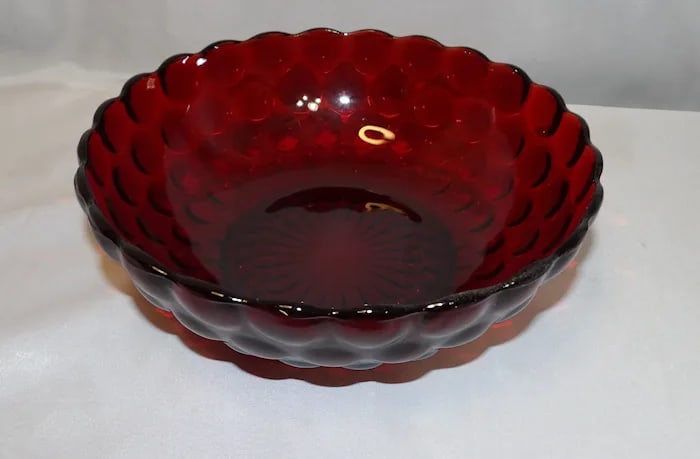 Anchor Hocking Royal Ruby Bubble Serving Bowl: Large vintage serving bowl in Royal Ruby glass by Anchor Hocking, featuring the classic bubble pattern. Shipping:Domestic: Flat-rate of $18.00 to anywhere within the contiguous U.S.International: