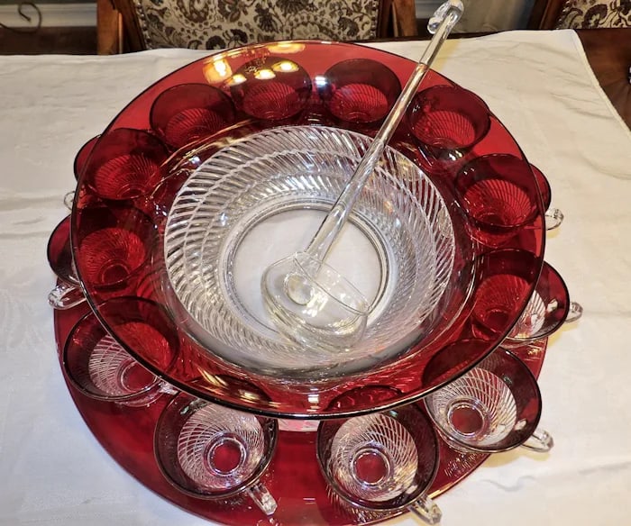 Ruby Flashed Punch Bowl Underplate Cups: A stunning ruby flashed glass punch set including a large punch bowl, matching underplate, and several cups with ornate clear patterns. Shipping: Domestic: Flat-rate of $125.00 to anywhere within the