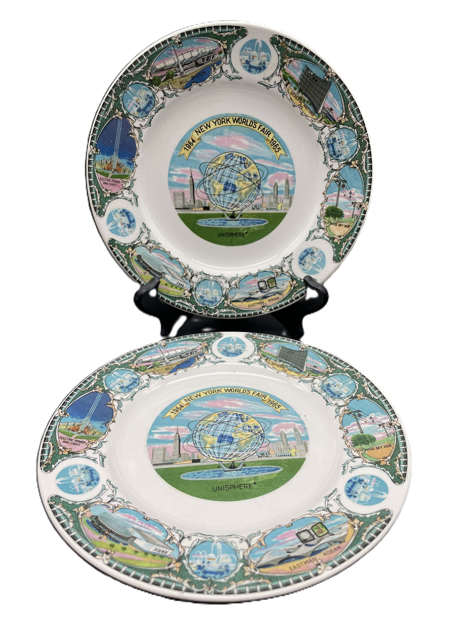 Pair of 1964-65 New York World's Fair Plates United States Steel Unisphere: Date/Period: 1964-64Dimension: Approx 7" diameterMaterial: ceramicAdditional Information: Pair of 1964-65 New York World's Fair Plate - Unisphere Presented by United States Steel Shipping:Domestic: