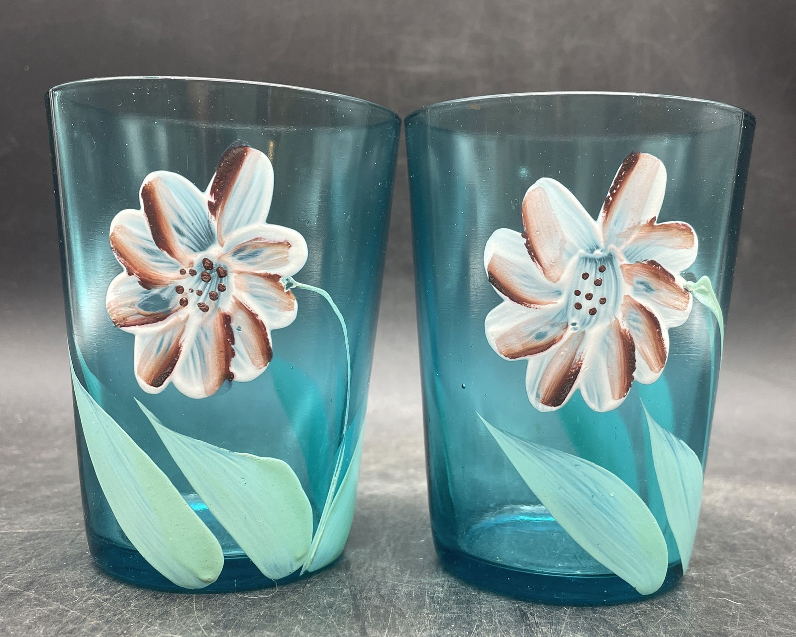 Antique Hand Painted Victorian Blue Glass Tumblers: Date/Period: unknownDimension: Approx. 4" x 3"Material: glassAdditional Information: Antique Hand Painted Victorian Blue Glass Tumblers marked with an E on the bottom. Shipping:Domestic: Flat-rate