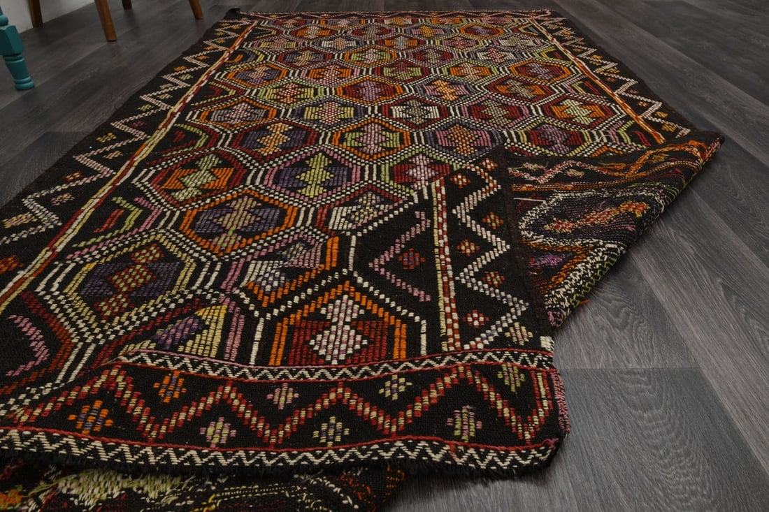 5x9 Black Colorful TURKISH Flatweave Kilim: Title: 5x9 Black Colorful TURKISH Flatweave Kilim Origin: Turkey Date/Period: 1960 - 1970 Materials: Wool and Cotton Size: Width: 4.7 feet; Length: 8.5 feet Description: This Turkish one-of-a-kind