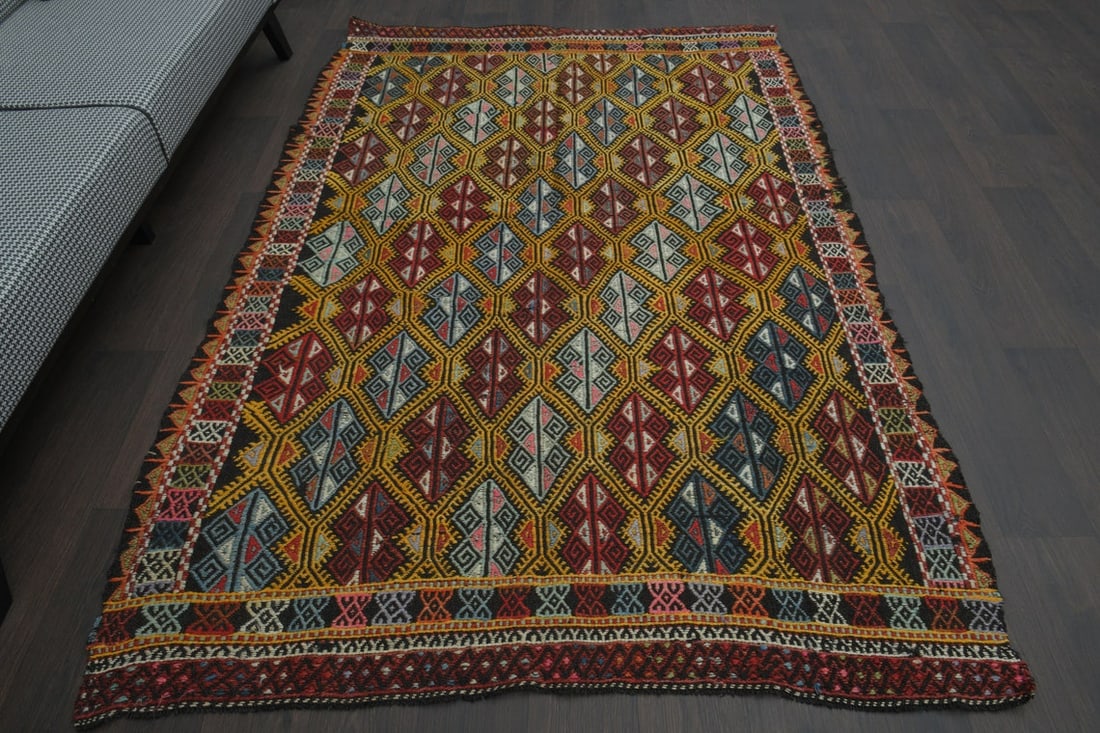 5x8 Kilim Flatweave Turkish Rug: Title: 5x8 Kilim Flatweave Turkish Rug Origin: Turkey Date/Period: 1960 - 1970 Materials: Wool and Cotton Size: Width: 5.1 feet; Length: 7.7 feet Description: This Turkish one-of-a-kind Vintage