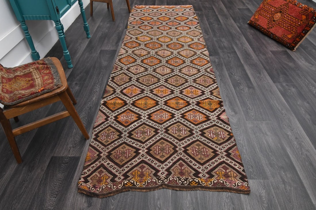 3.4x11.2 ft, TURKISH KILIM Runner: Title: 3.4x11.2 ft, TURKISH KILIM Runner Origin: Turkey Date/Period: 1960 - 1970 Materials: Wool and Cotton Size: Width: 3.4 feet; Length: 11.2 feet Description: This Turkish one-of-a-kind Vintage