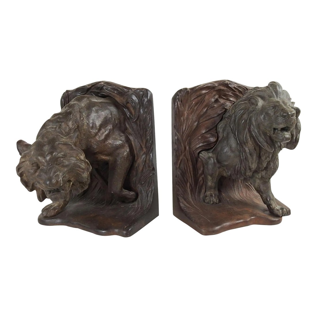 Early 20th Century Bradley Hubbard Lion Tiger Cast Iron Bookends: Antique circa 1915 cast iron Bradley and Hubbard lion and tiger bookends. Very striking and quite heavy, over 7 pounds each, marked BH on backs. Dimensions are for one bookend, overall dark patina.