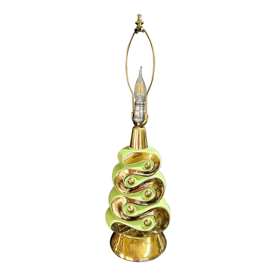 Mid 20th Century Pistachio Green and Gold, Ceramic Table Lamp: Such a fun and spirited piece of artwork, from the 60's! This ceramic lamp cannot help but catch your eye"”the bright gold color winds its way around the lamp, contrasting beautifully with the