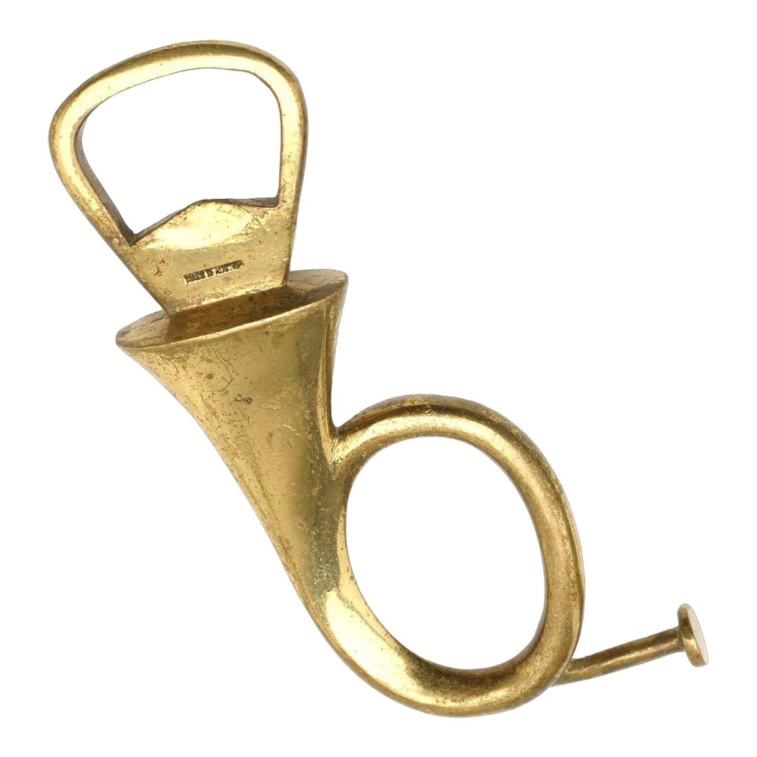 Carl Auböck II French Horn Bottled Opener, 1950: Carl Auböck II French Horn Bottled Opener, 1950 model 4567, Werkstätte Carl Auböck, Austria Impressed manufacturer's mark to underside of French horn 'Made in Austria' Solid Brass with