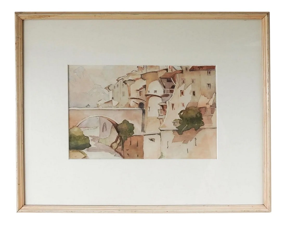 Vintage Sunlit Whitewashed Architecture Watercolor Painting: Early 20th century watercolor on paper. Unusual group of cylindrical whitewashed buildings beside a river bridge with what may be a mouse on the bridge. Unsigned. Displayed under glass and mat in