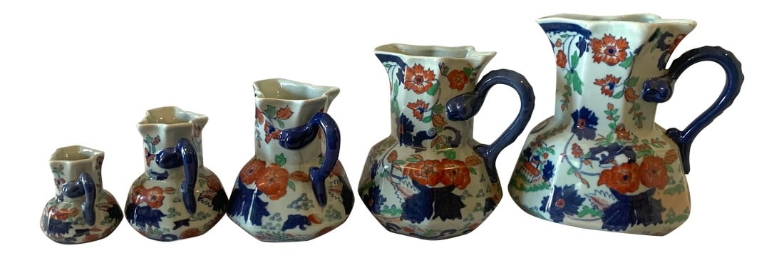 Iron Stone China Pitcher Set - 5 Pieces: Hand painted set of Iron stone China pitchers set with blue and orange lower design.There are five pitchers sizes from 11" to 4" high. Condition: Alterations: Original Condition Unaltered