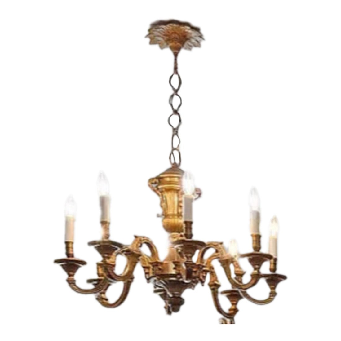 Antique French Gilt Bronze Louis XV Eight Arm Chandelier: An antique French gilt bronze chandelier in the Louis XV style. This particular chandelier was imported from France. It has eight arms, each designed to hold a light fixture, extending outward in a gr